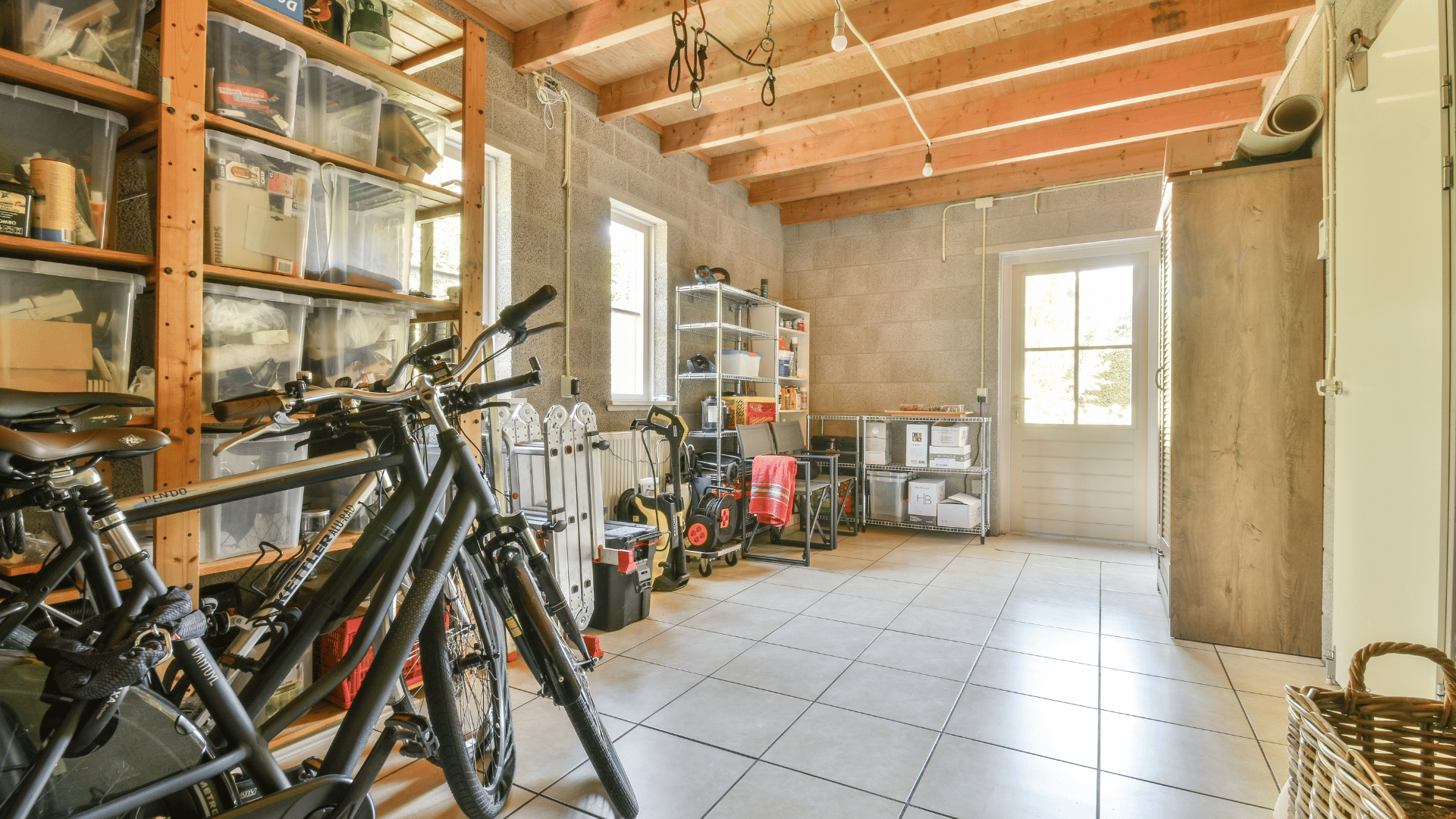 Custom built utility shed with shelving, garden tool storage, workspace, and overhead storage loft