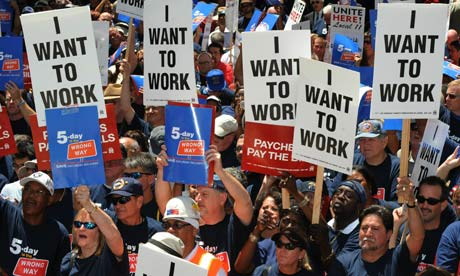 A crowd of people holding up signs that say i want to work