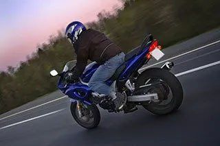 Person Riding Motorcycle Across Raeford, NC