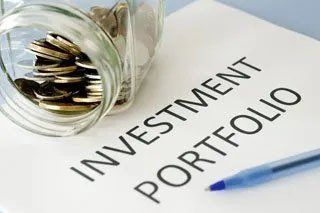 Investment Portfolio, Pen, and Jar Full of Coins