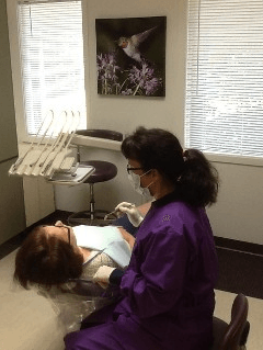 Dentist checking patient's teeth — Family practice in Kirkland, WA Dentist checking patient's teeth — Family practice in Kirkland, WA