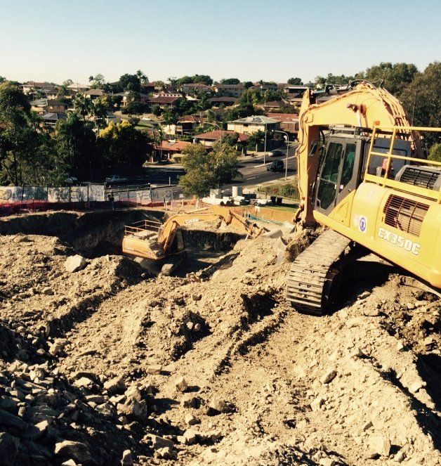 earth being excavated using machine