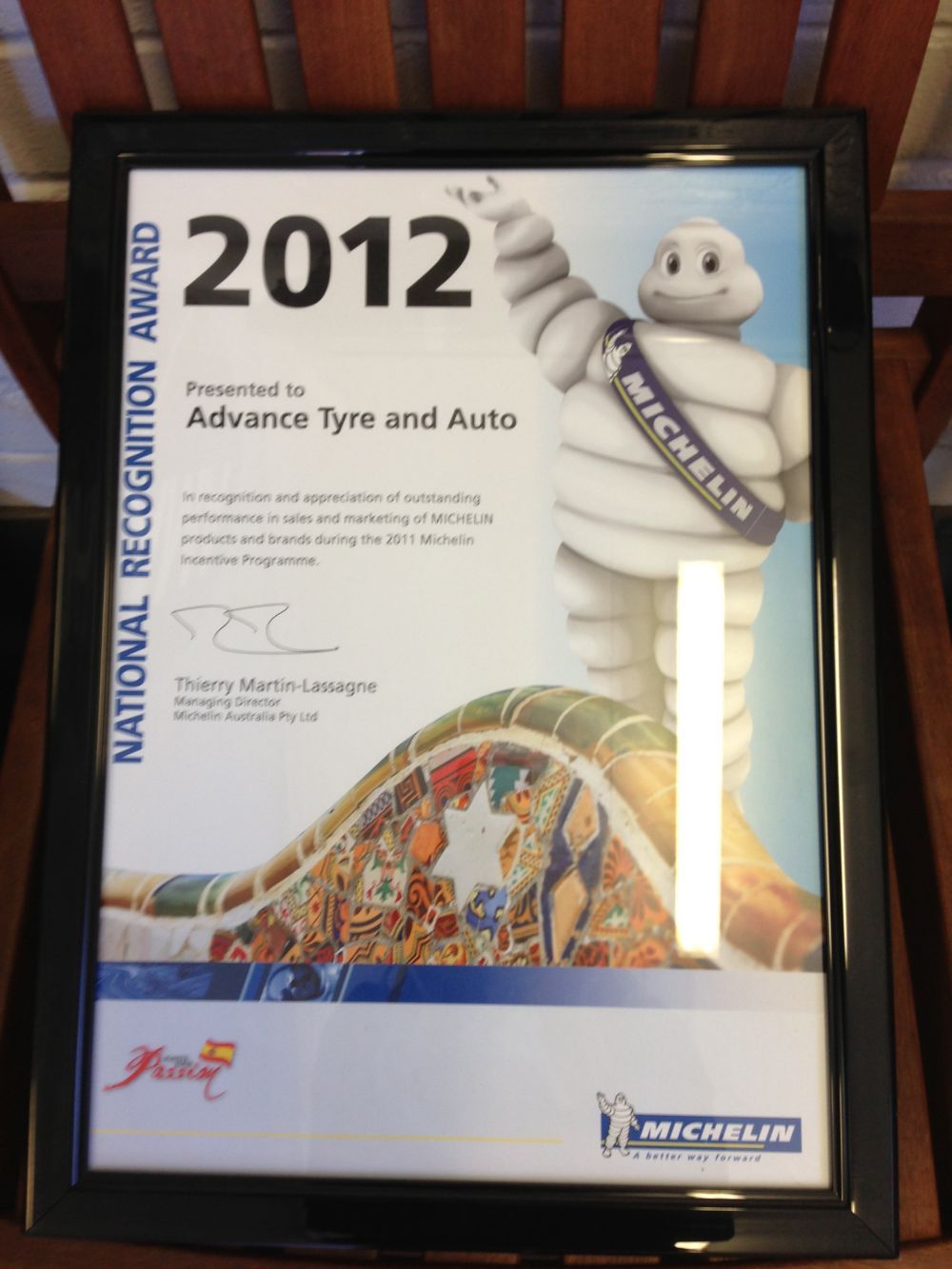 2012 Michelin National Recognition Award, framed. Awarded to Advance Tyre and Auto. Features Michelin Man and colorful artwork.