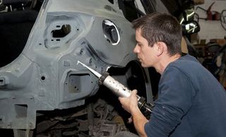 mechanic working on car body mechanic working on car body