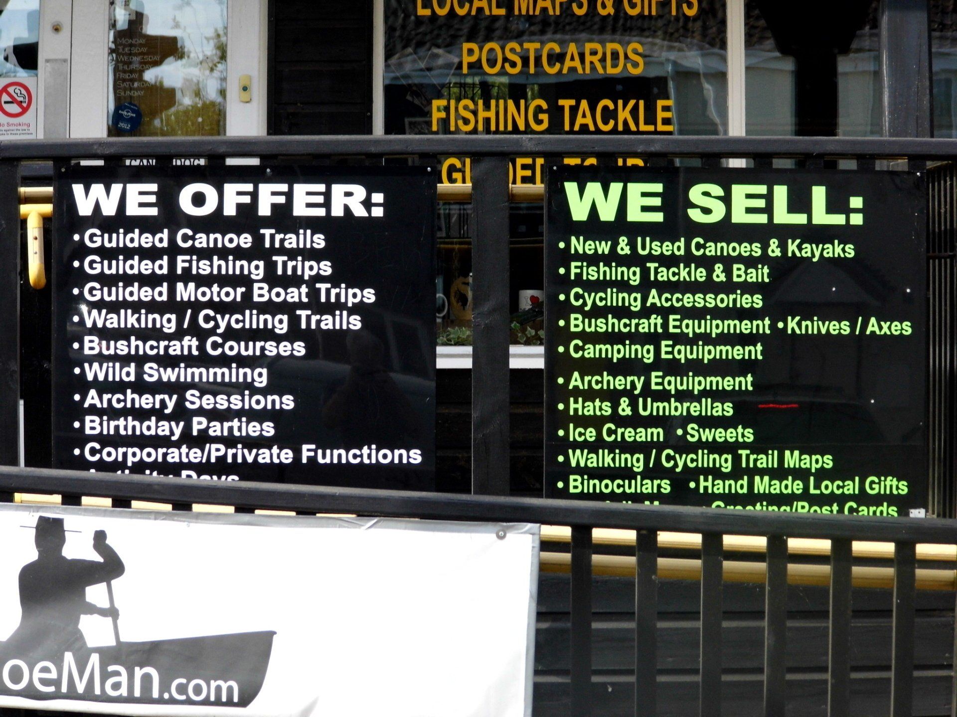 click to find out more about Canoeman. shop sign listing various organised fishing and boating activities