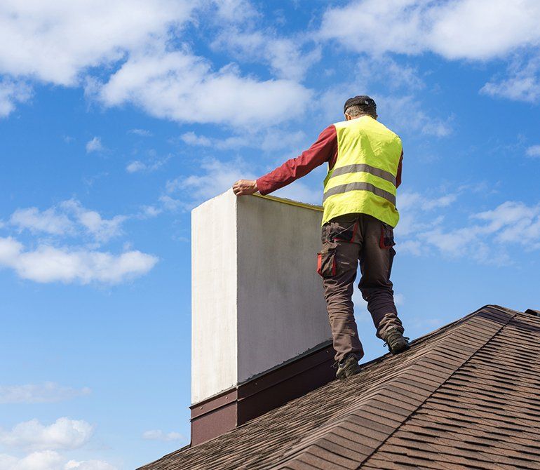Man Measuring Chimney On Roof Top — Smallwood, NY — Liberty Chimney & Sons