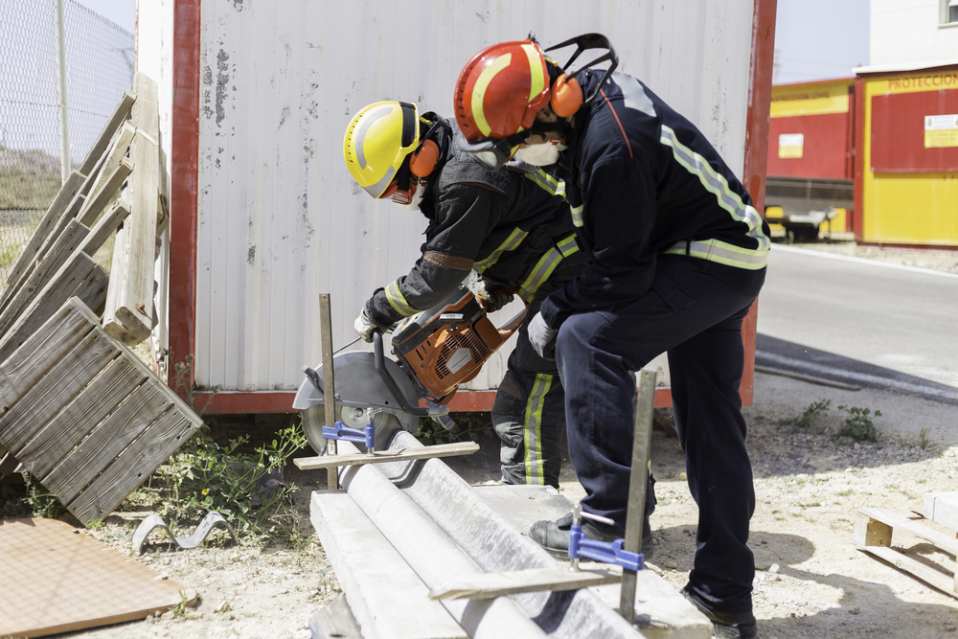 Contractors cutting a concrete slab