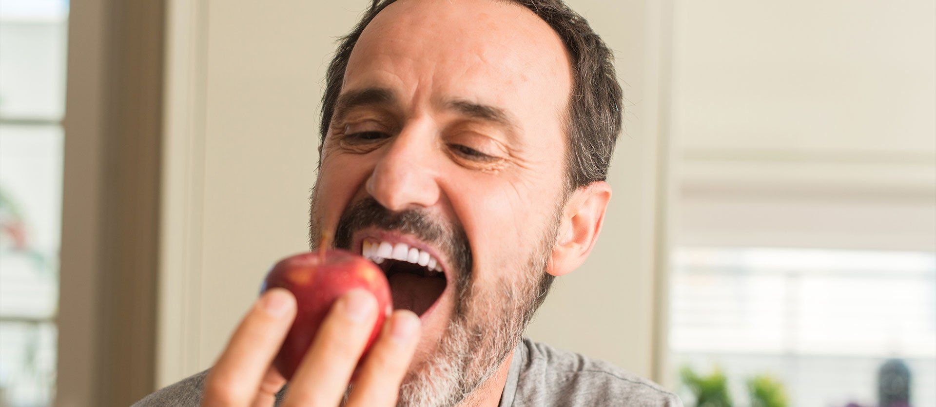 man eating apple