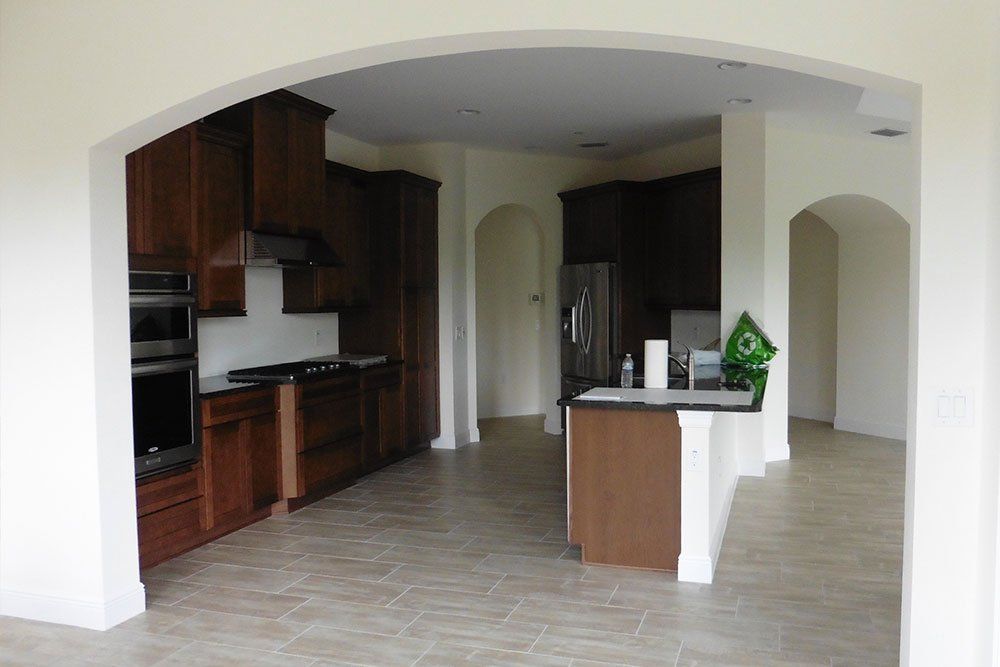 A kitchen with wooden cabinets and stainless steel appliances.