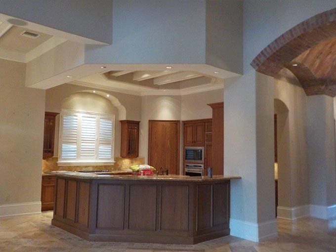 A kitchen with a large island in the middle.