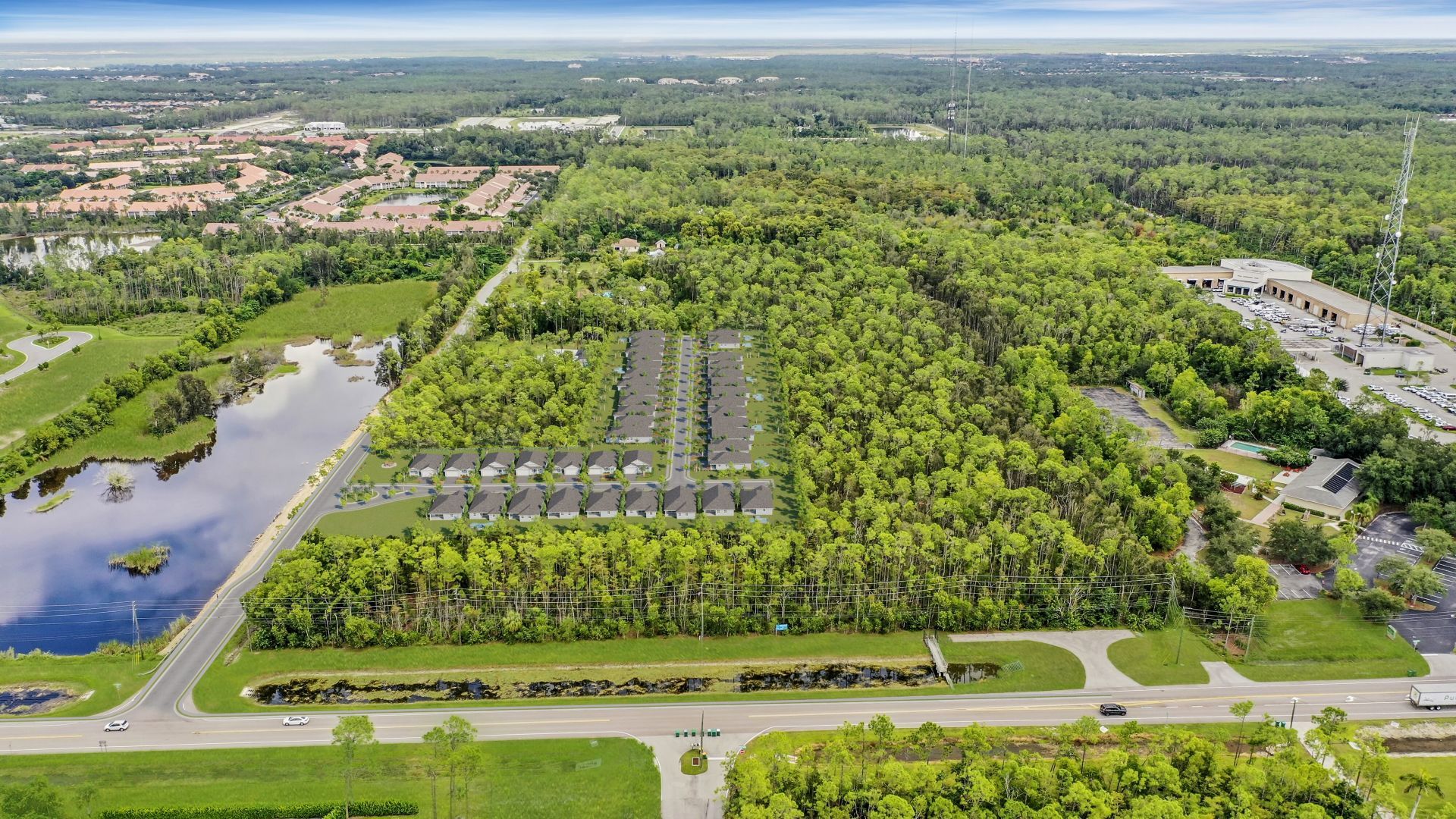 An aerial view of a residential area surrounded by trees and a lake — Naples, FL — Genuine Home Builders, Inc.