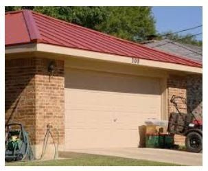 Leaking Roof — Side Image of House with Red Roof in San Antonio, TX