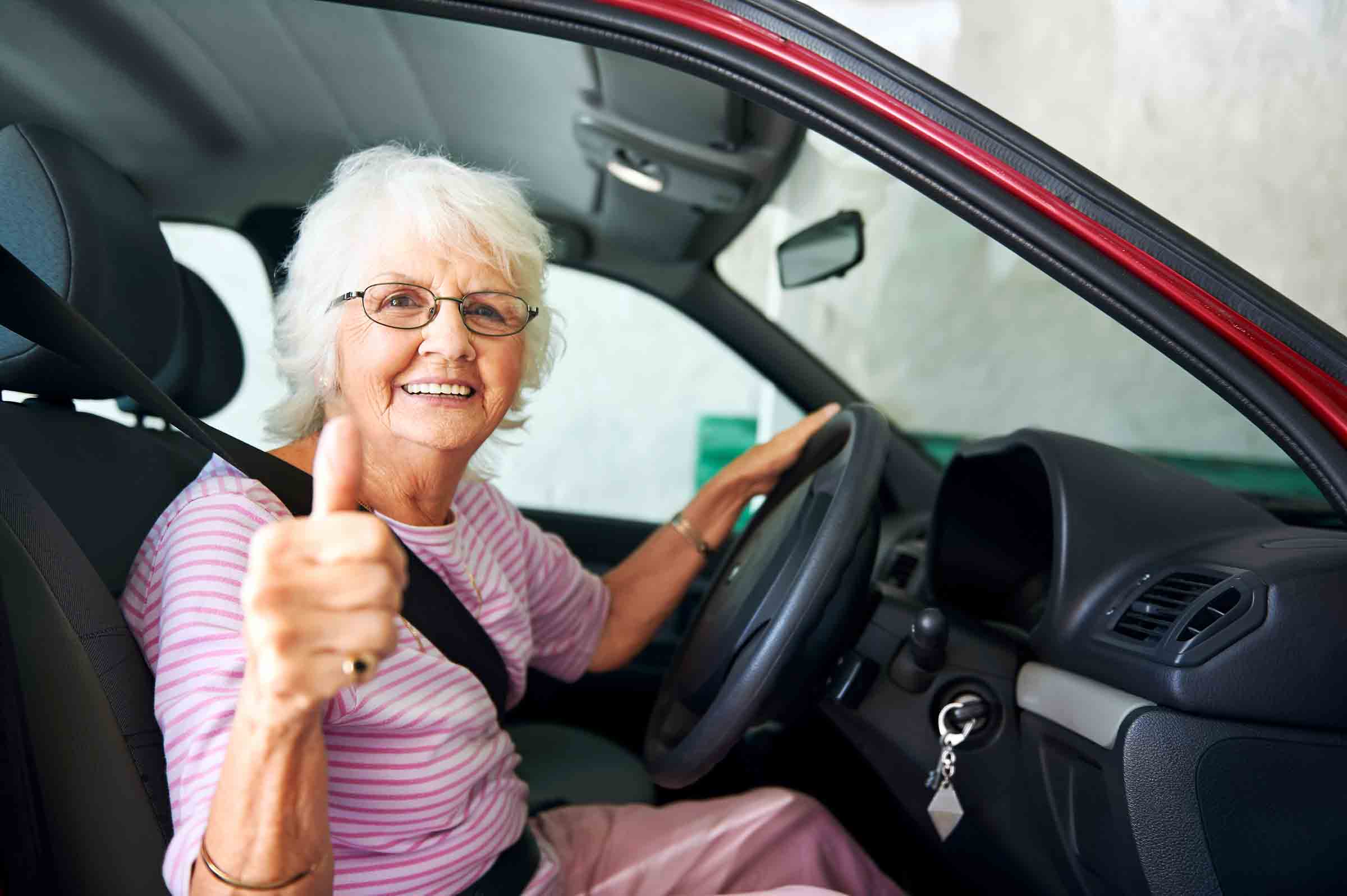 elderly woman driving