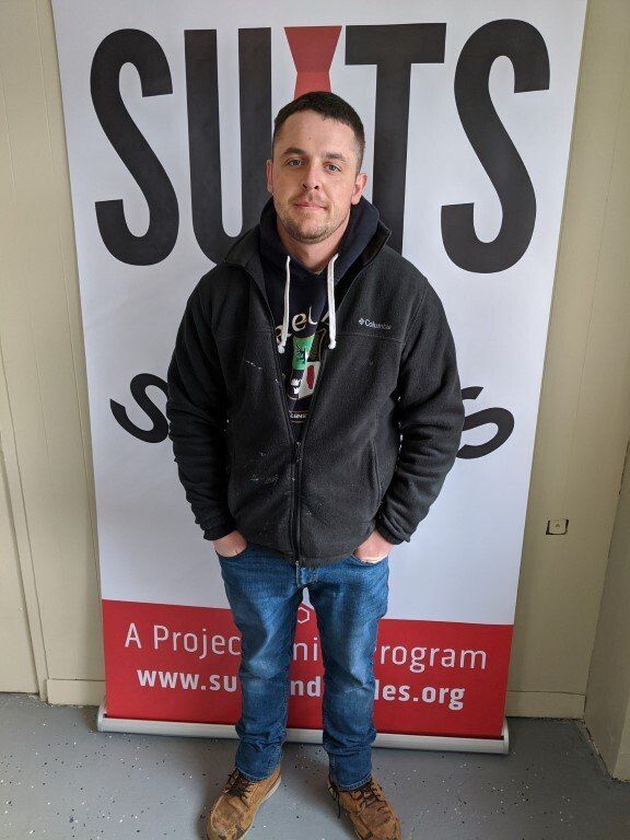 Man before suit donation