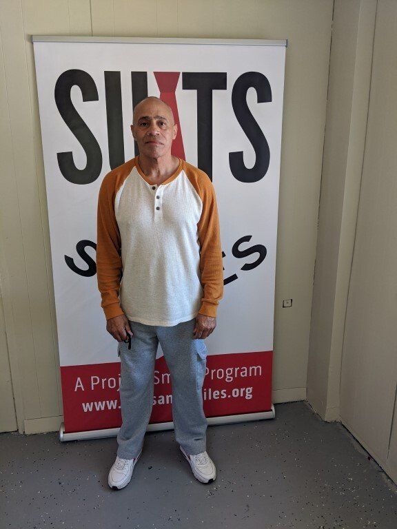Man before suit donation