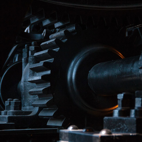 A close up of a gear in a dark room