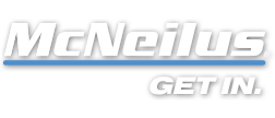 A white and blue logo for mcneilus get in