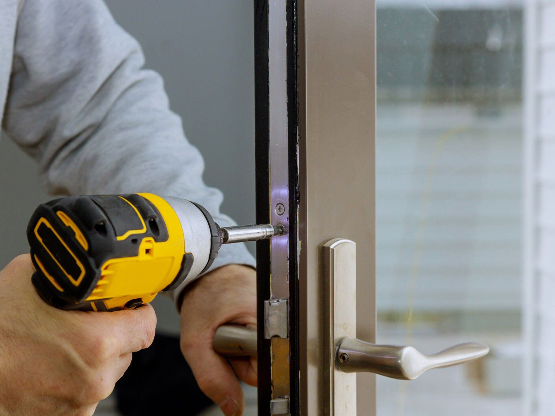 Locksmith Installing New House Lock — Oakwood, GA — Ace Lock & Safe Security