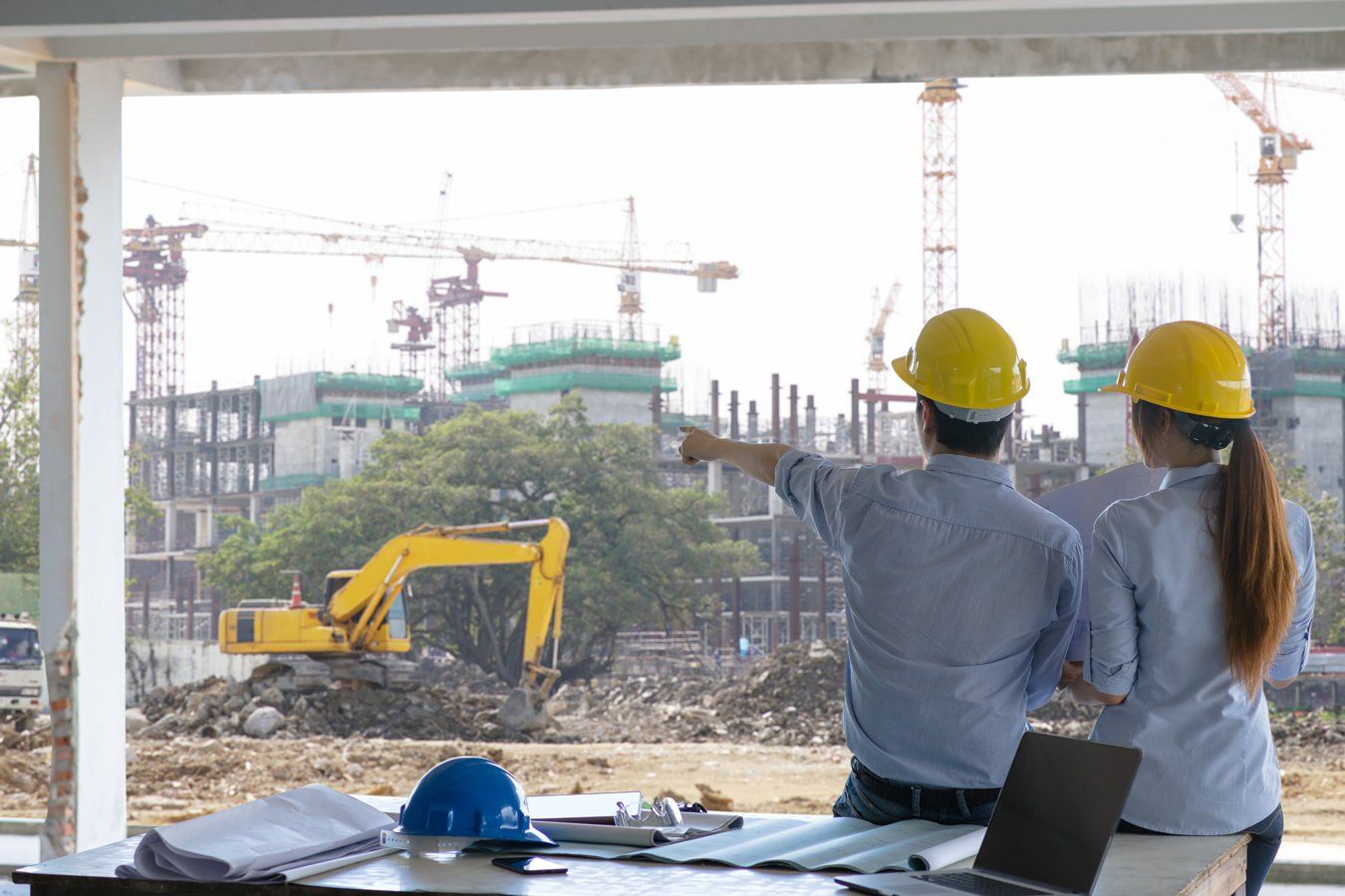 engineers pointing on construction site