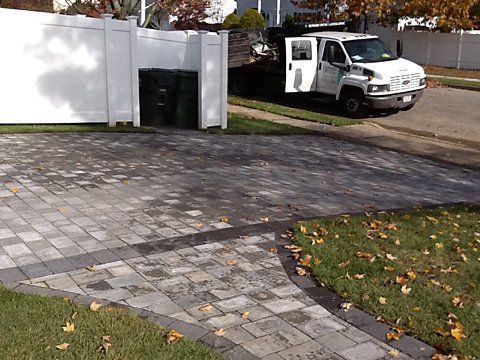 Garage Stonework Driveway — Lakewood, NJ — Howard Payne Landscaping & Design Inc.
