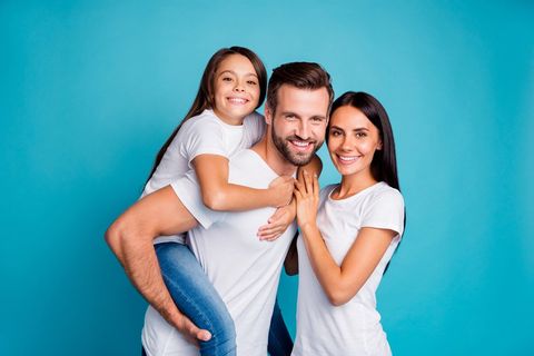 Family Smiling — Lutz, FL — Dr. William J Geyer Dr. Leslie Hernandez