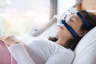 Woman with CPAP Machine — Lutz, FL — Dr. William J Geyer Dr. Leslie Hernandez