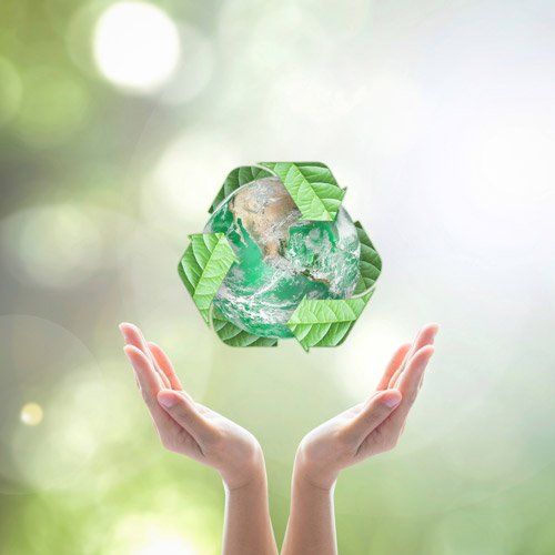 Hands Under Green Planet with Recycle Sign — Oklahoma City, OK — Standard Iron & Metal Co., LLC. Hands Under Green Planet with Recycle Sign — Oklahoma City, OK — Standard Iron & Metal Co., LLC.