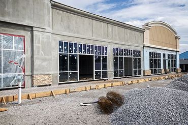 a large building with a lot of windows is being built .