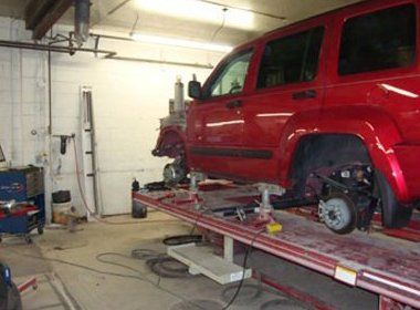 Repairing a Red SUV — Findlay, OH — Findlay Body Repair Co. LTD Repairing a Red SUV — Findlay, OH — Findlay Body Repair Co. LTD