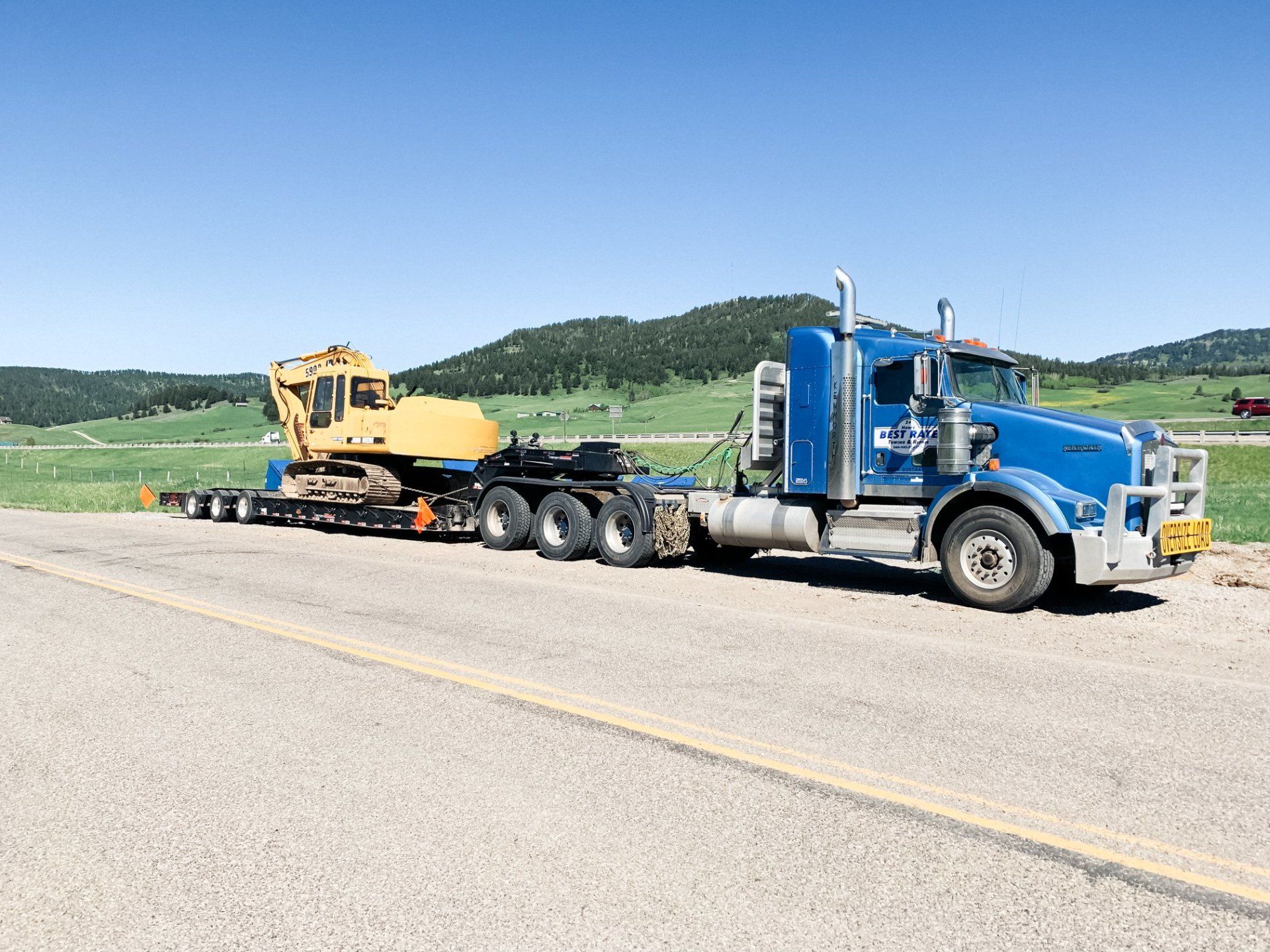 24/7 Towing Near Me — Delivery Truck Pulled By Tow Truck in Gallatin County, MT 24/7 Towing Near Me — Delivery Truck Pulled By Tow Truck in Gallatin County, MT