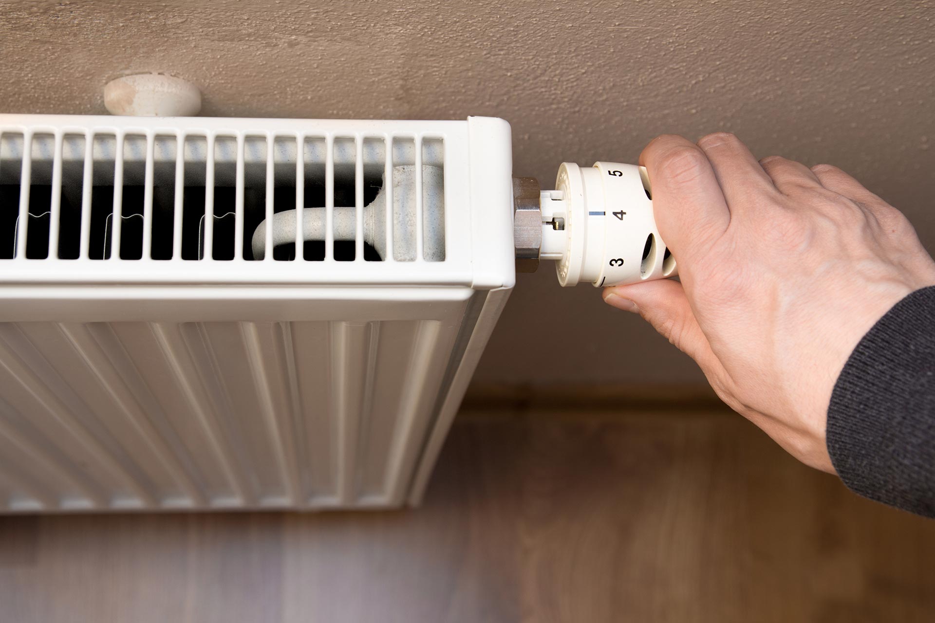 man connecting room heating system