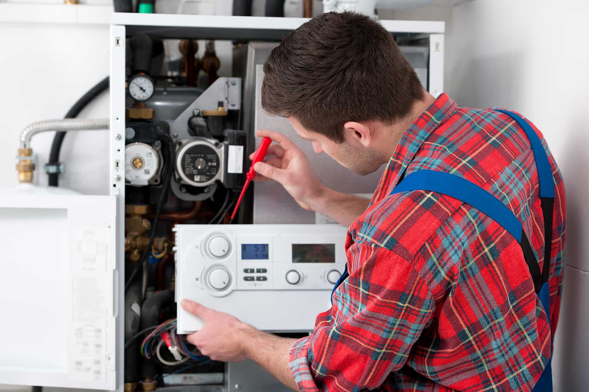 expert repairing the heating system