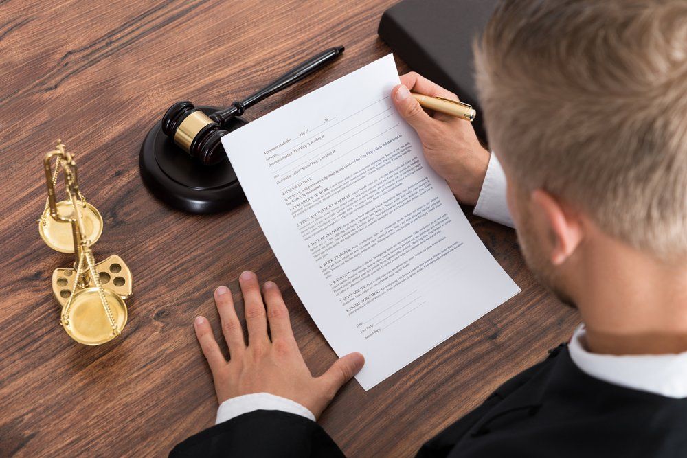 Florida Paralegal Assistance — Judge Reading Law Document In Courtroom in Lakeland, FL Florida Paralegal Assistance — Judge Reading Law Document In Courtroom in Lakeland, FL