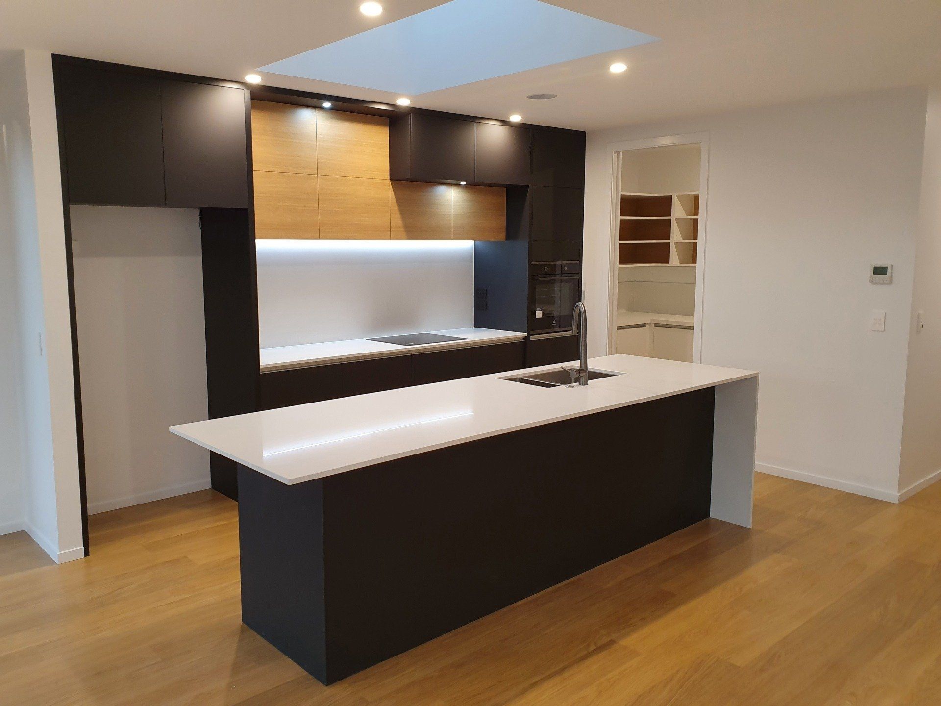 There is a large island in the middle of the kitchen.