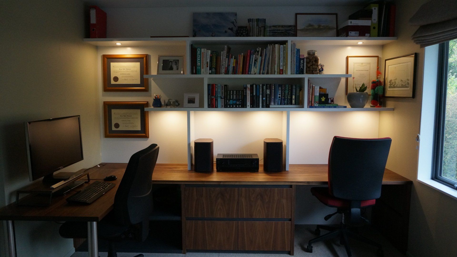 A home office with two desks and two chairs