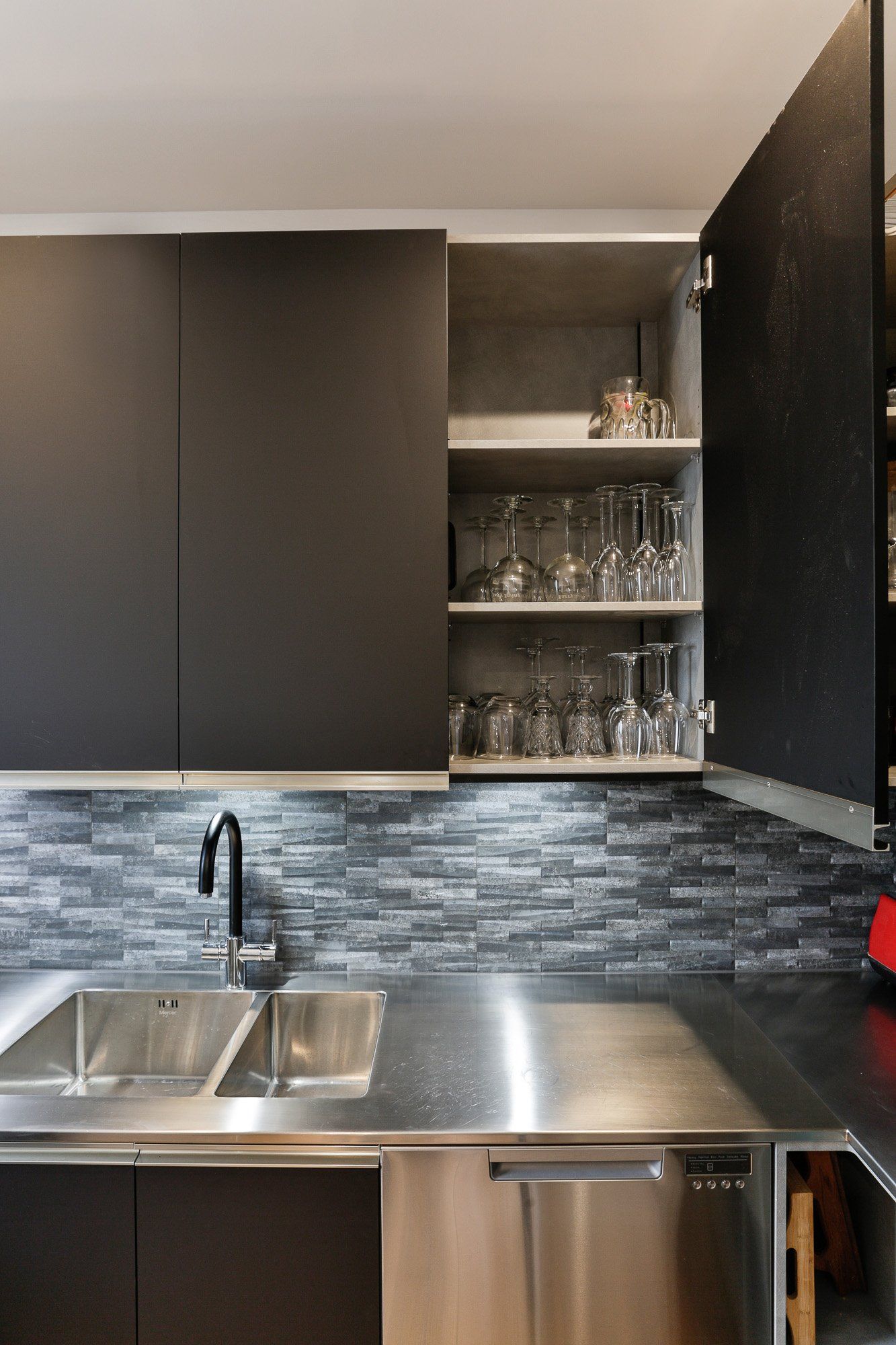 A kitchen with stainless steel appliances and a sink