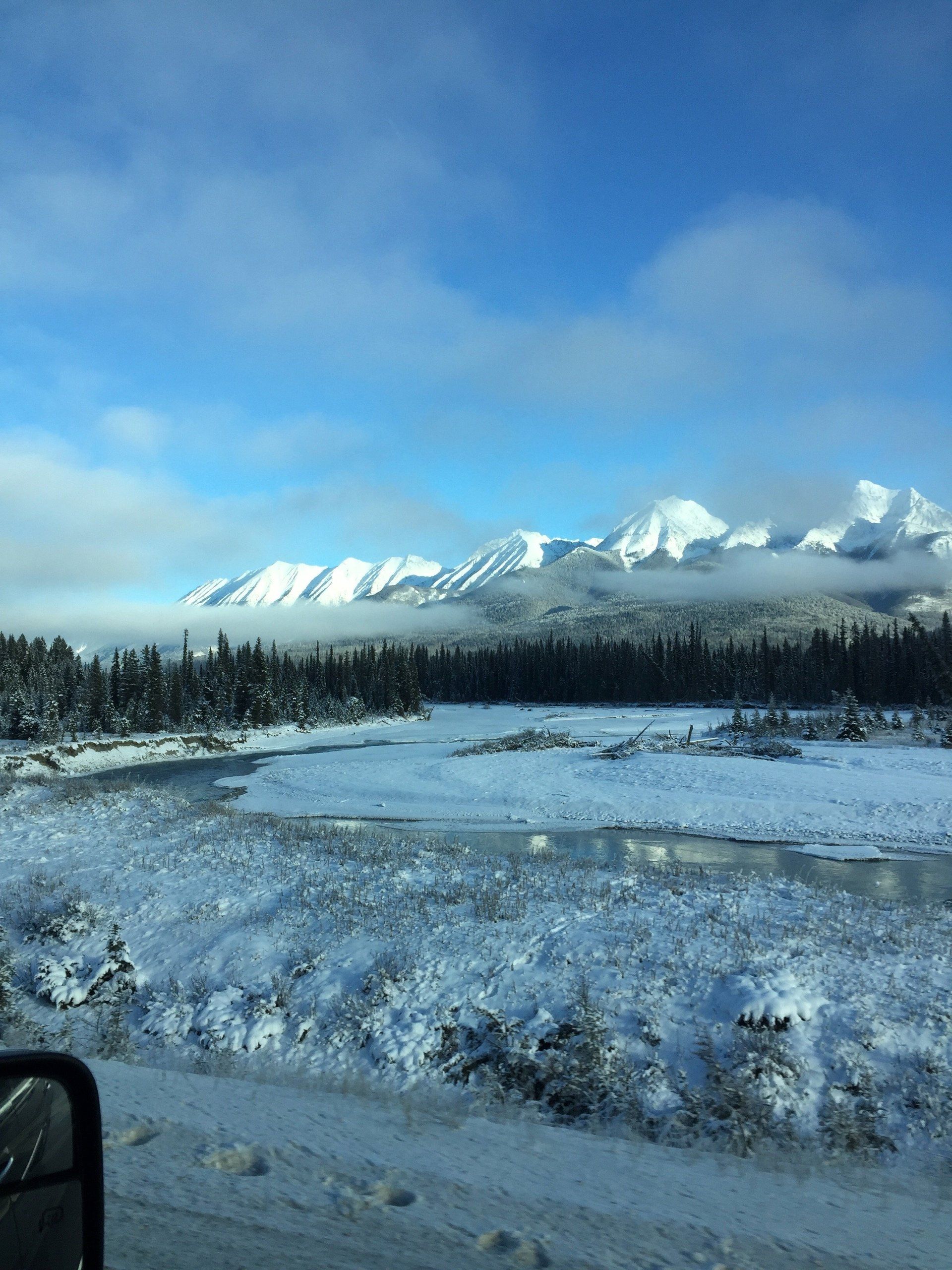 Private Tours - Map Out Your Own Locations or Let Us Suggest Some Amazing Destinations snow covered mountains against blue sky with pine trees at the base