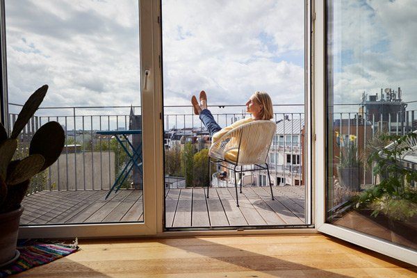 woman lounging on balcony