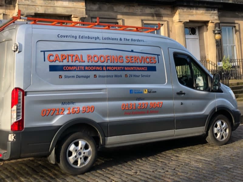 Side shot of the Capital Roofing services van