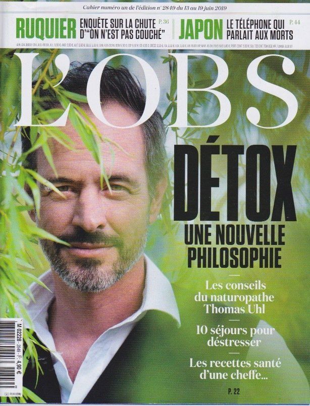 Un homme avec une barbe est sur la couverture d'un magazine