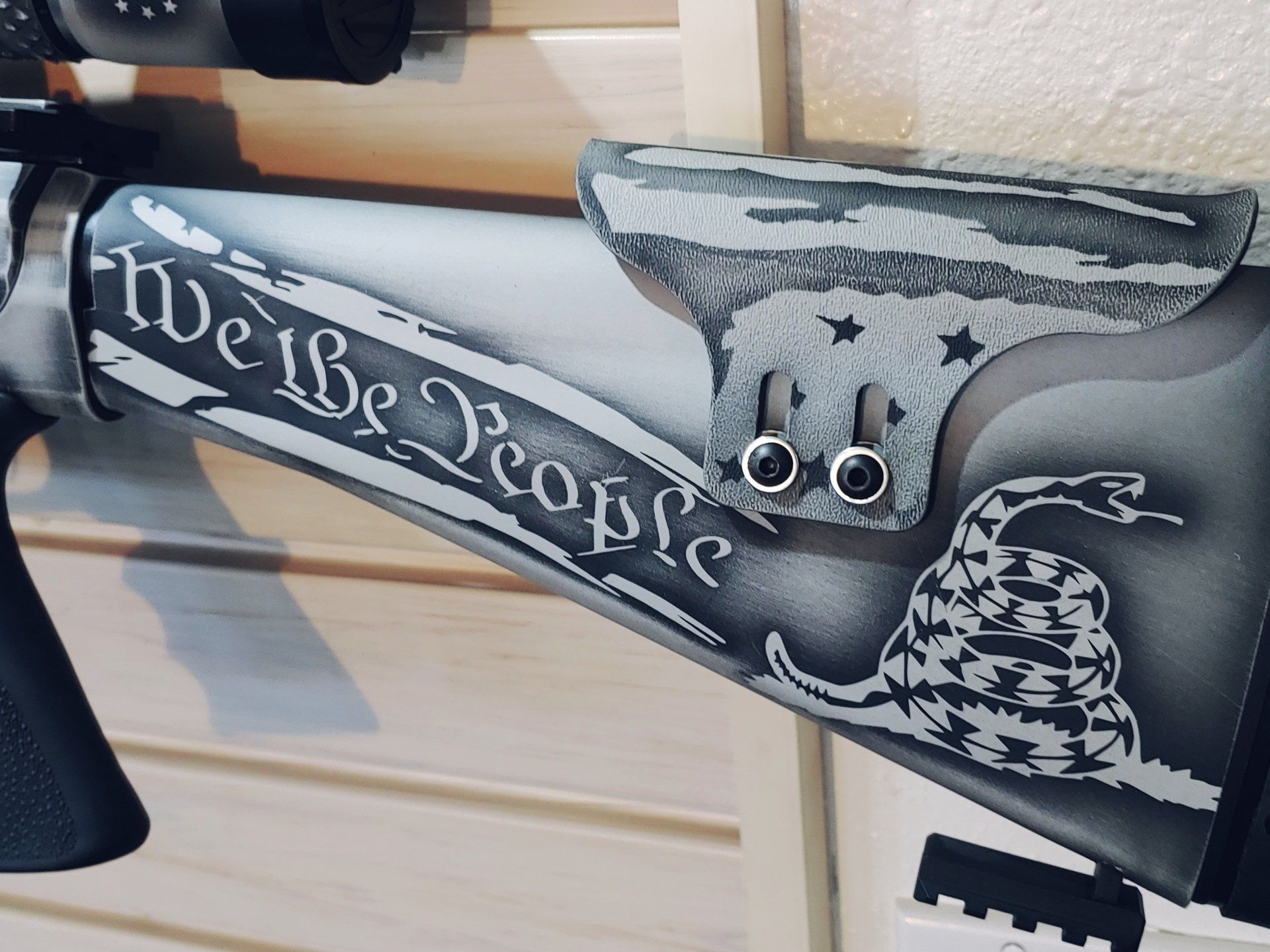 A rifle stock with patriotic artwork: