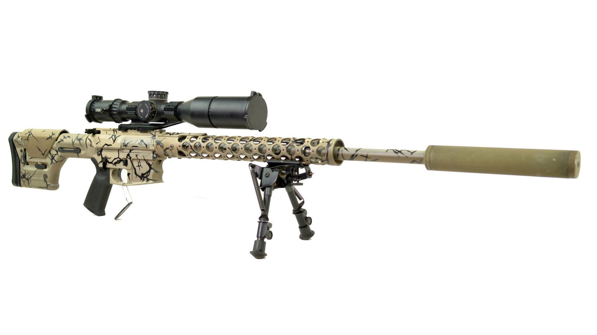 Camouflage sniper rifle with scope, bipod, and silencer.