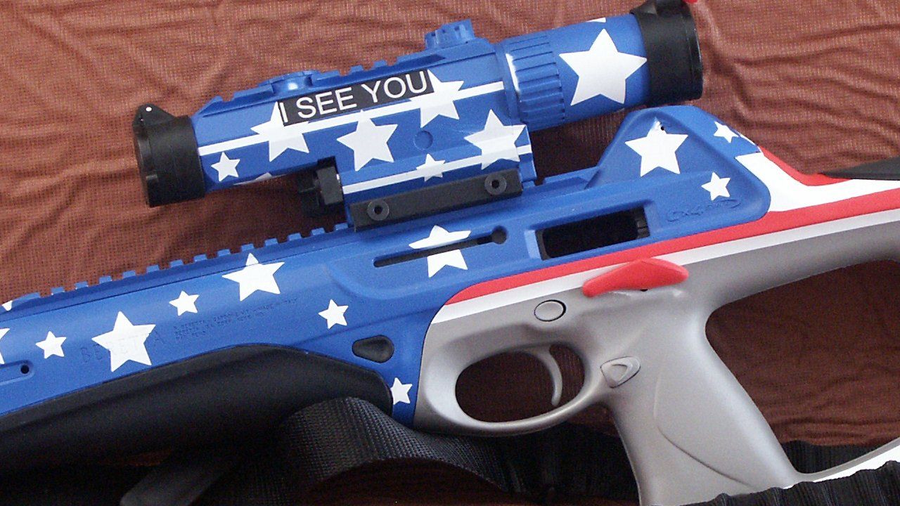 Blue, white, and red toy gun with star pattern and