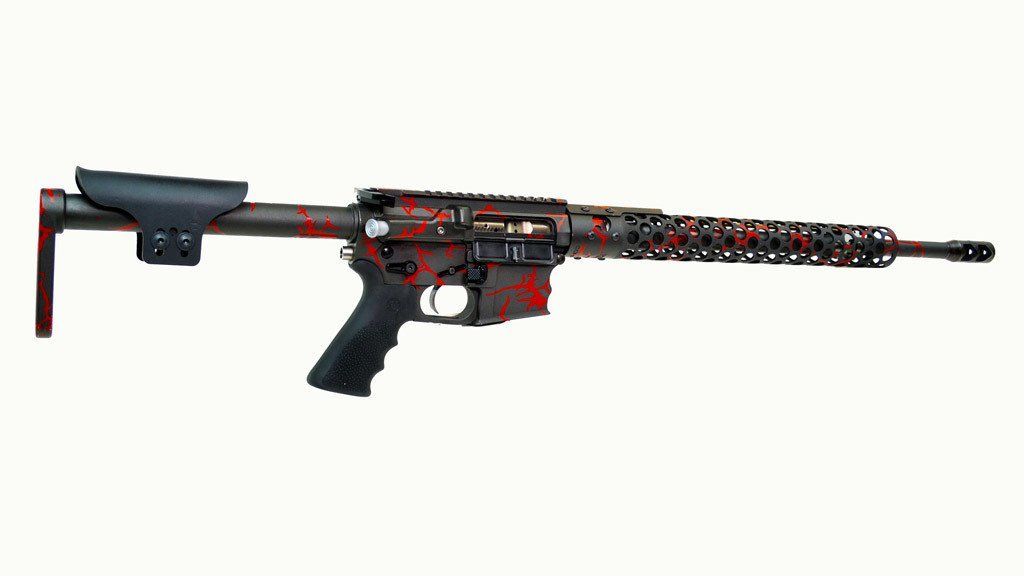 Red and black decorated rifle against a white background.