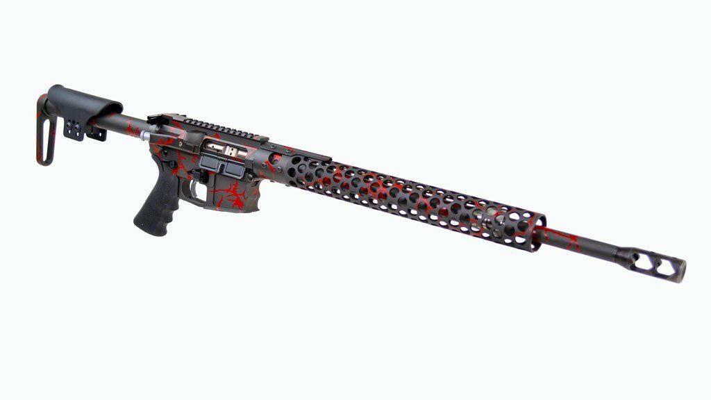 Black and red rifle with a skeletonized handguard and stock, resting against a white background.