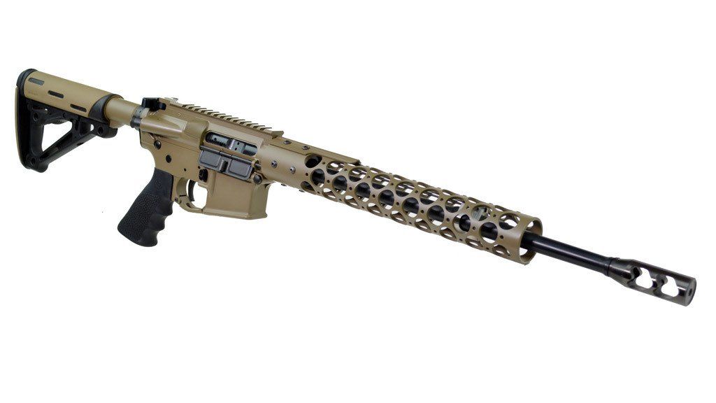 Tan and black AR-15 style rifle with a skeletal handguard, muzzle brake, and angled grip.
