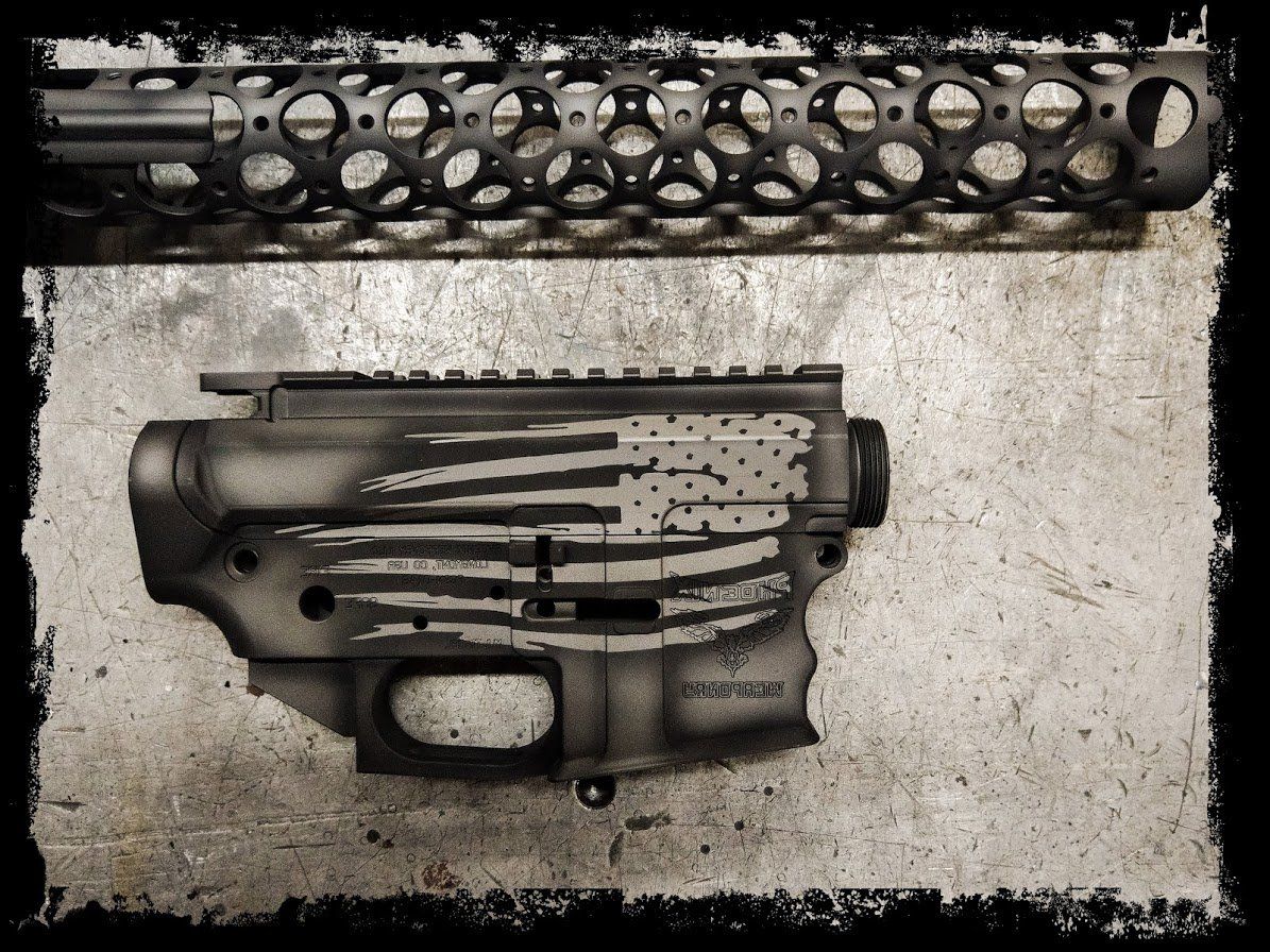 Black and gray firearm receiver and handguard with a distressed American flag design.