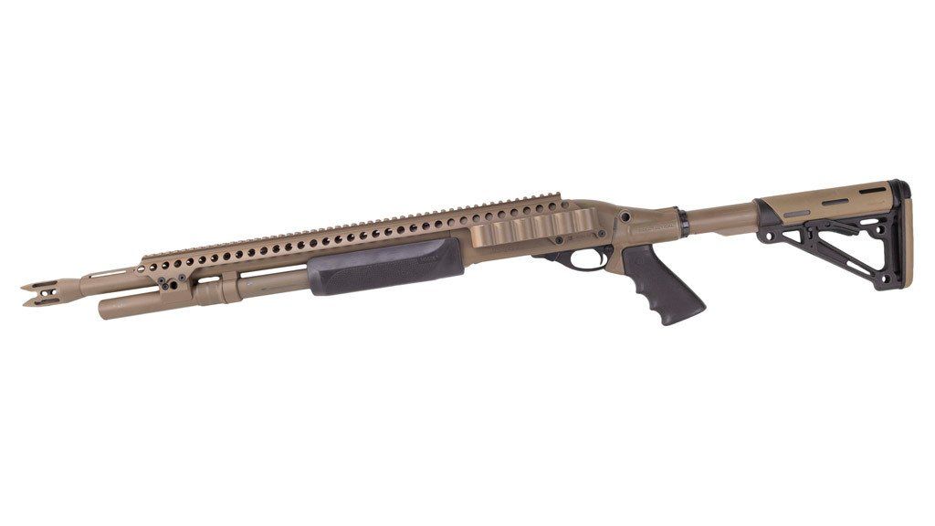 Tan tactical shotgun with a rail system, pistol grip, and adjustable stock.