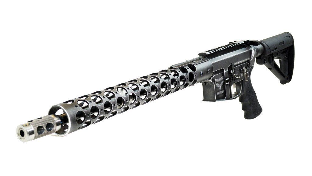 Black rifle with a unique, perforated barrel, stock, and pistol grip, isolated on white.