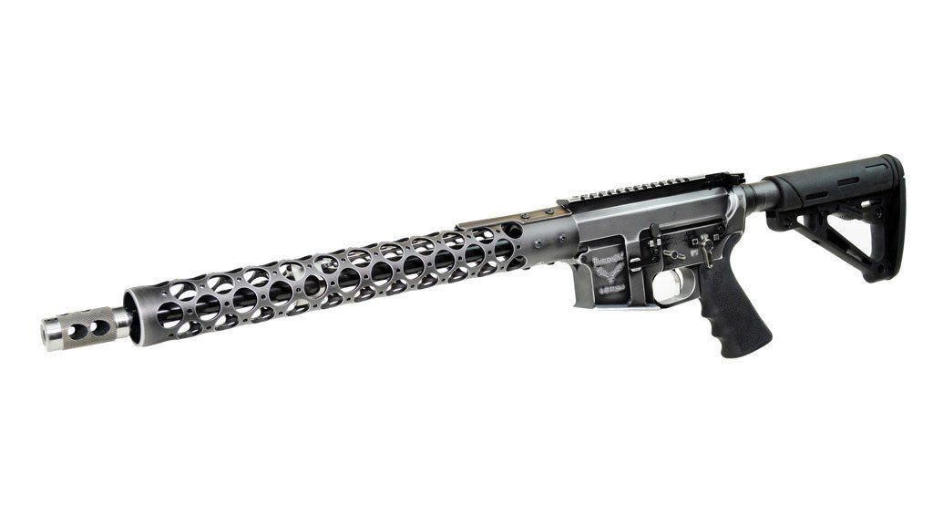 Silver and black rifle with long, patterned handguard and tactical stock.